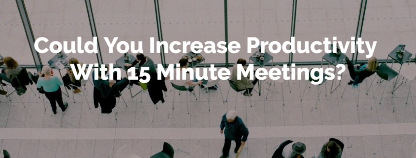 Birds eye view of some business people on white tiles with the title Could You Increase Productivity With 15 Minute Meetings? overlaid on top in white