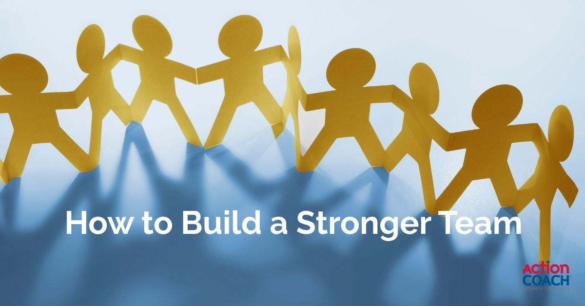 Paper cut-out chain of people holding hands, representing teamwork, collaboration, and strategies for building a stronger business team.